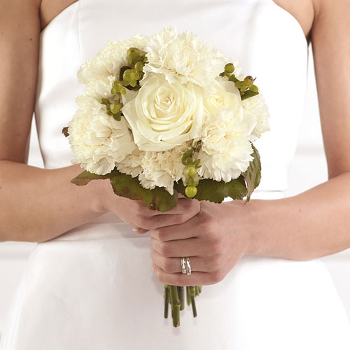 Roses carnations and hypericum berries accented with galax leaves